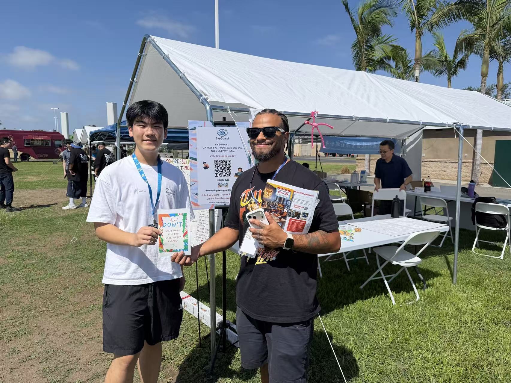 Introducing EyeGuard to an attendee at the 2026 Maker Faire Orange County